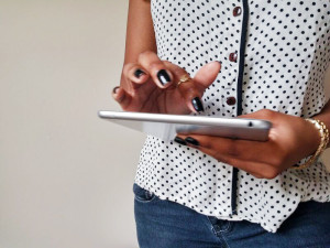 black-woman-holding-ipad-createherstock